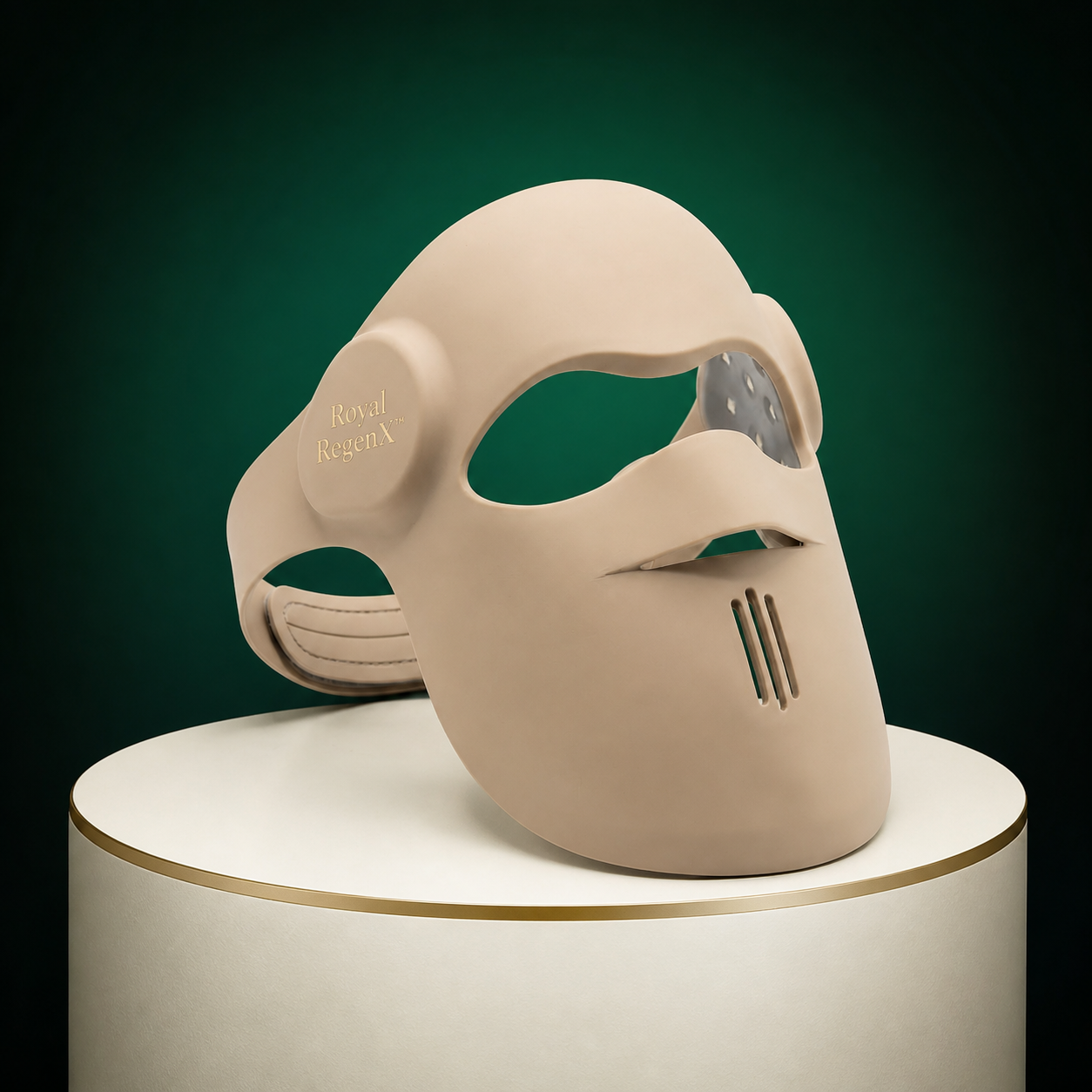 Royal RegenX™ LumiFace Pro LED Mask, a contoured cream face mask displayed on a gold-rimmed podium